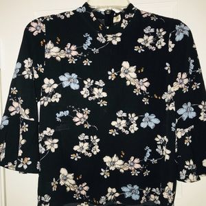 Blouse. Flirty. Black w/flowers. High neck.